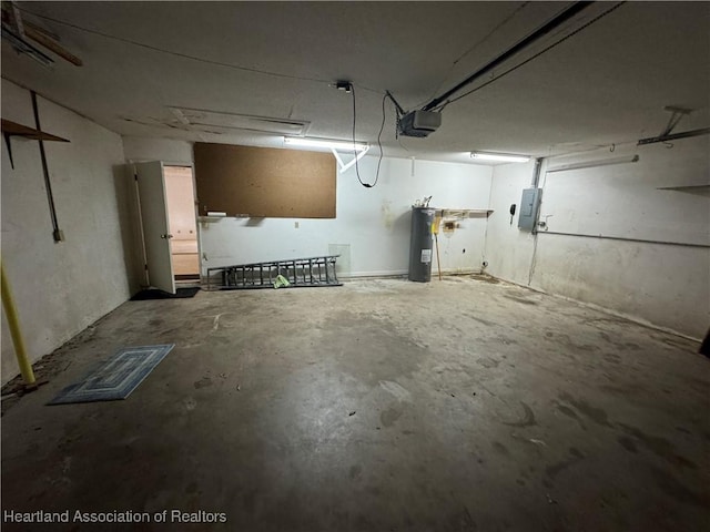 garage with a garage door opener, electric panel, and water heater