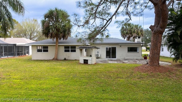 back of house featuring a yard