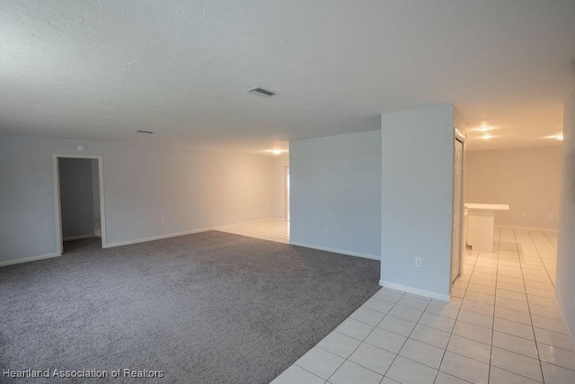 empty room with light tile patterned floors