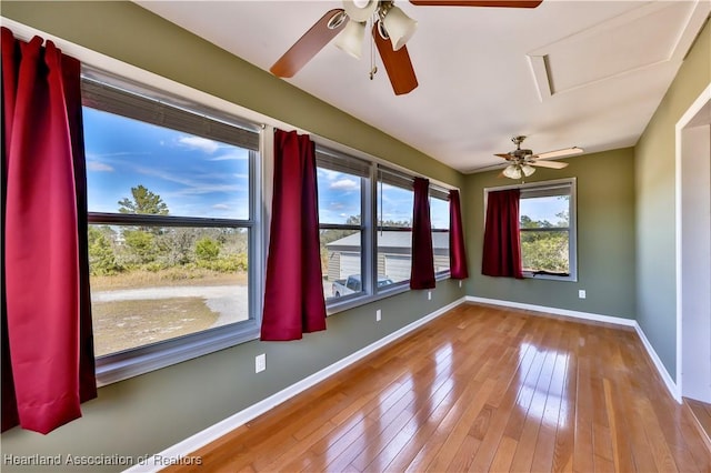 spare room with hardwood / wood-style floors