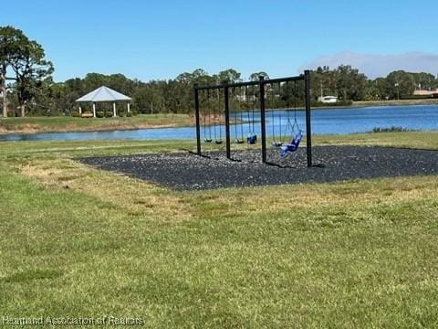 view of home's community featuring a water view, a gazebo, and a lawn