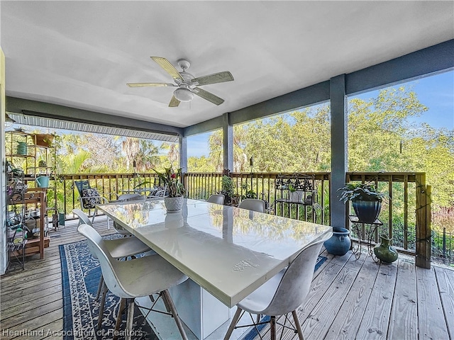 sunroom featuring ceiling fan