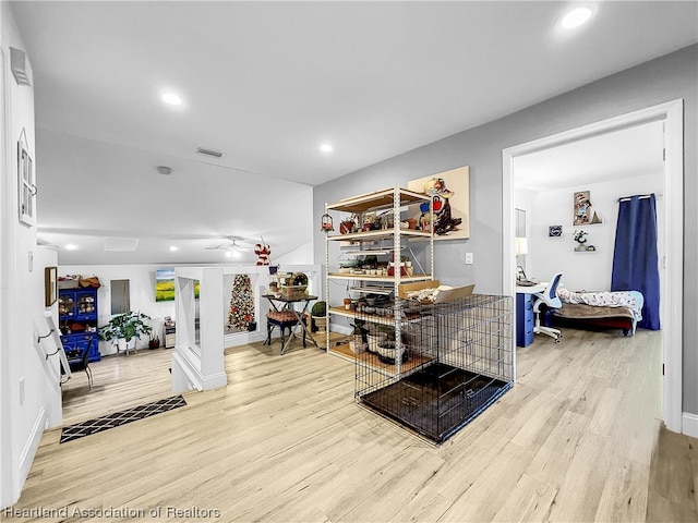 interior space with ceiling fan and light hardwood / wood-style flooring