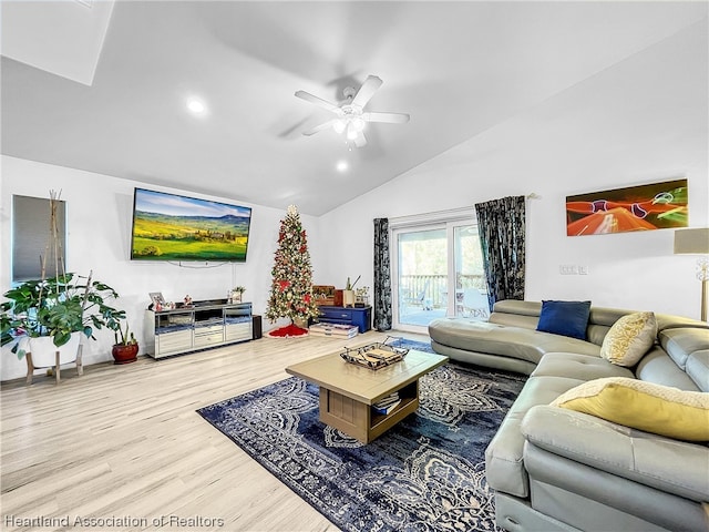 living room featuring wood-type flooring, high vaulted ceiling, and ceiling fan