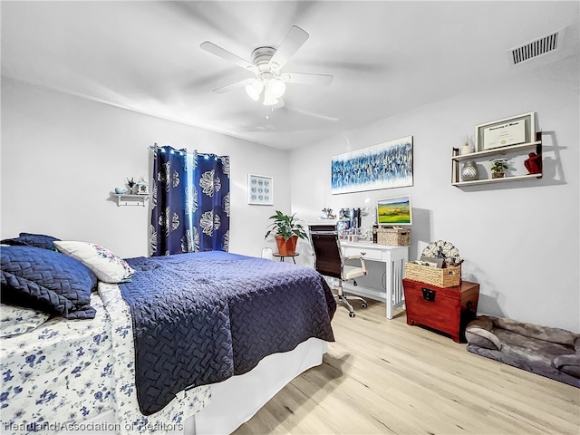 bedroom featuring light hardwood / wood-style floors and ceiling fan