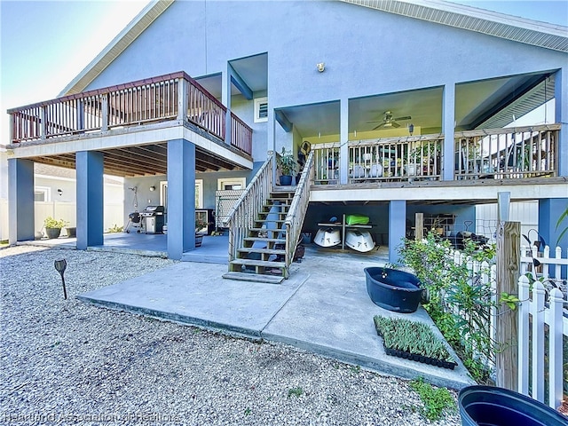 view of patio featuring area for grilling and ceiling fan