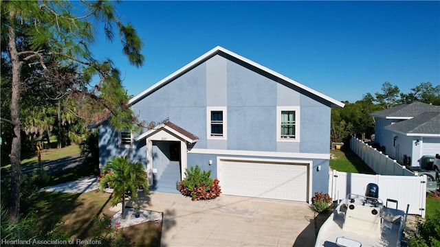 view of front of property with a garage