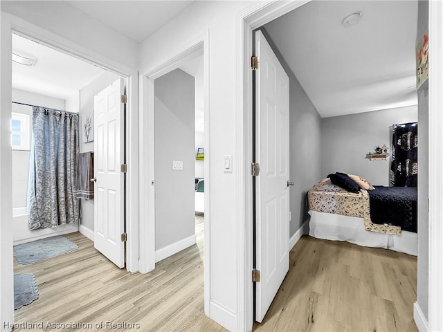 bedroom with light wood-type flooring