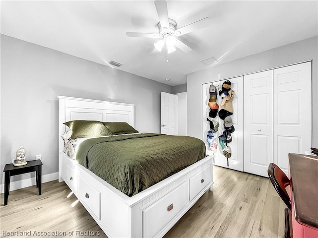 bedroom with ceiling fan, a closet, and light hardwood / wood-style flooring