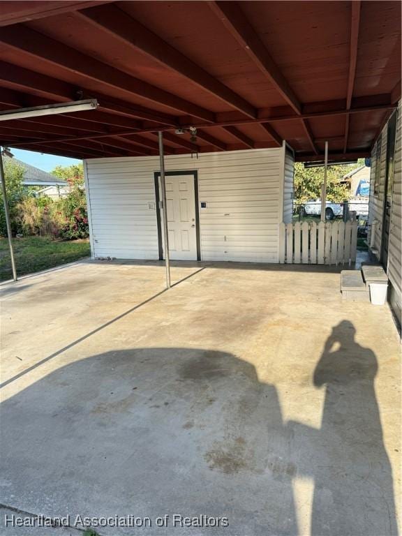 garage featuring a carport