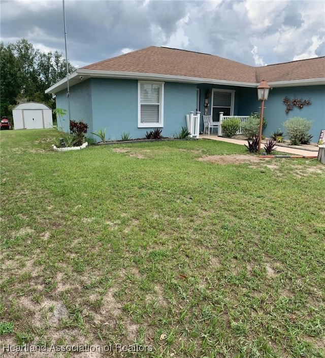 2010 W Royalton Rd, Avon Park, FL 33825 - ranch-style house featuring a porch, a storage unit, a front yard, and stucco siding