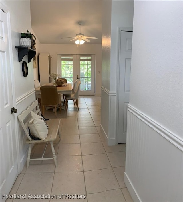 2010 W Royalton Rd, Avon Park, FL 33825 - corridor with wainscoting and light tile patterned flooring