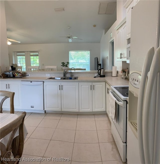2010 W Royalton Rd, Avon Park, FL 33825 - kitchen featuring white appliances, a ceiling fan, white cabinets, light countertops, and vaulted ceiling