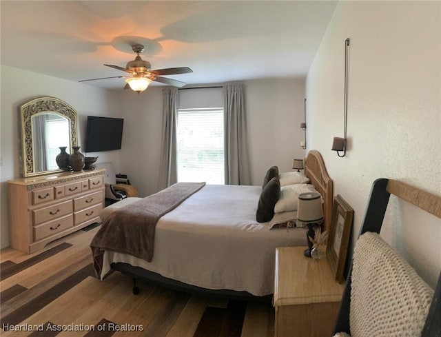 2010 W Royalton Rd, Avon Park, FL 33825 - bedroom featuring multiple windows, light wood-type flooring, and a ceiling fan