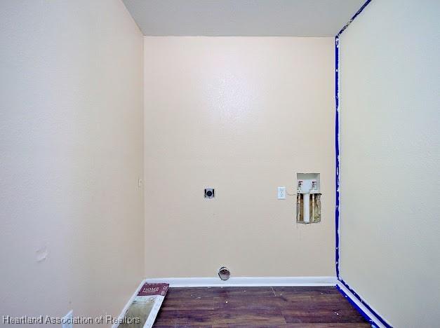 1916 Melady Ave, Sebring, FL 33870 - washroom with electric dryer hookup, wood finished floors, and hookup for a washing machine