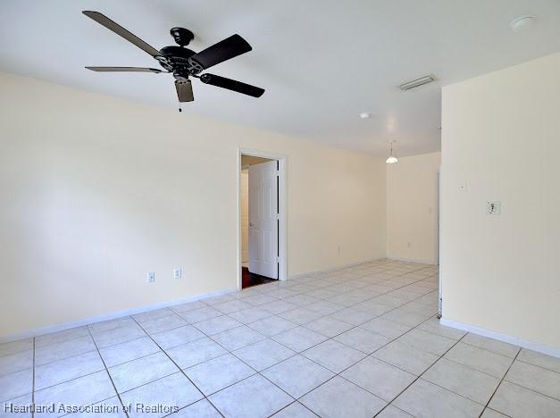 1916 Melady Ave, Sebring, FL 33870 - empty room featuring light tile patterned floors and a ceiling fan
