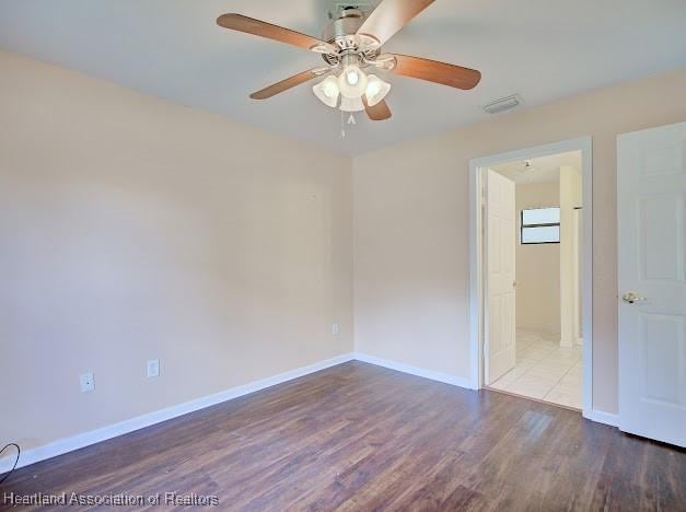 1916 Melady Ave, Sebring, FL 33870 - spare room with ceiling fan and wood finished floors