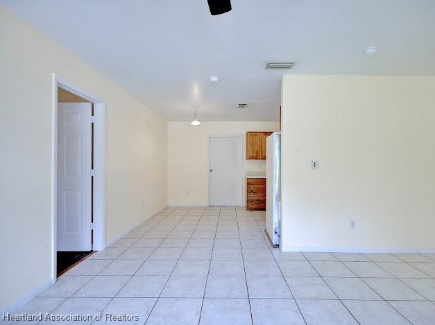 1916 Melady Ave, Sebring, FL 33870 - unfurnished room featuring light tile patterned flooring