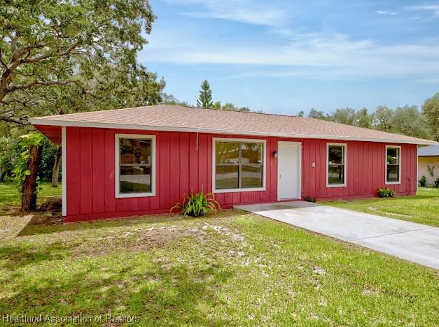 1916 Melady Ave, Sebring, FL 33870 - ranch-style house with a front lawn