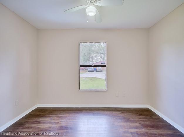 1916 Melady Ave, Sebring, FL 33870 - unfurnished room featuring wood finished floors and ceiling fan