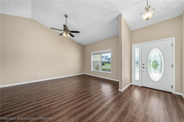 foyer featuring vaulted ceiling, dark hardwood / wood-style floors, and ceiling fan