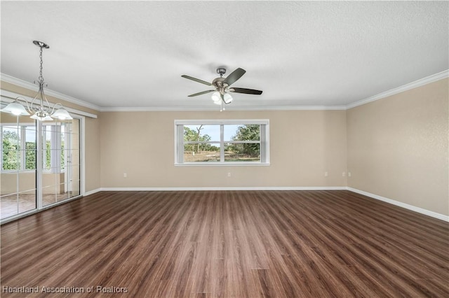 spare room featuring ornamental molding, dark hardwood / wood-style floors, and a textured ceiling