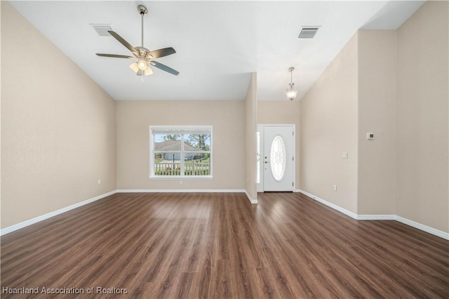 entrance foyer with ceiling fan, lofted ceiling, and dark hardwood / wood-style floors