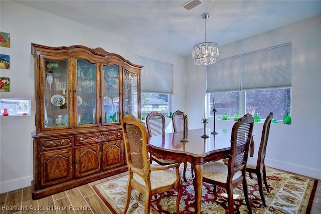 dining space featuring a chandelier