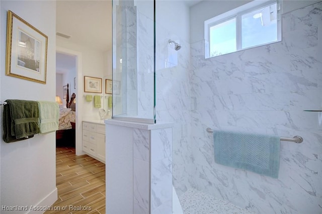 bathroom featuring tiled shower