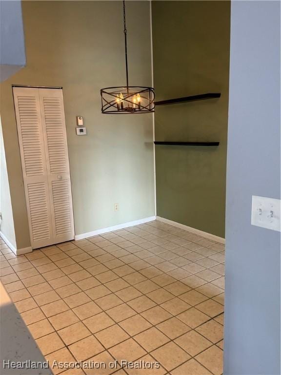 unfurnished dining area featuring light tile patterned flooring