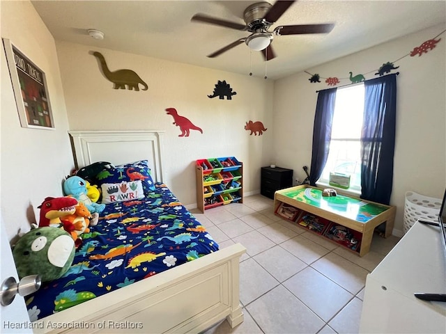 bedroom featuring ceiling fan and light tile patterned floors