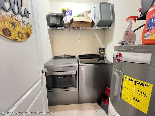 laundry room with separate washer and dryer, electric water heater, and light tile patterned floors