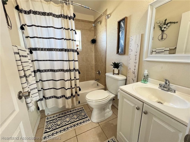 full bathroom with tile patterned flooring, vanity, toilet, and shower / bath combo with shower curtain