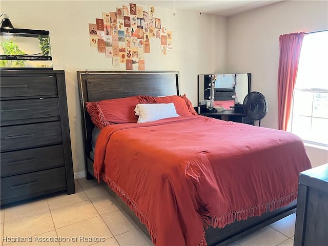 bedroom with light tile patterned floors