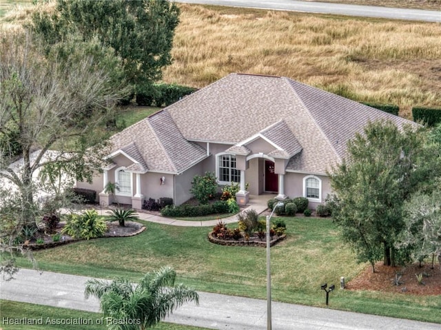 view of front of house featuring a front lawn