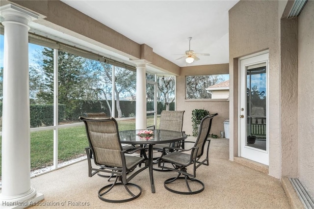 sunroom featuring ceiling fan