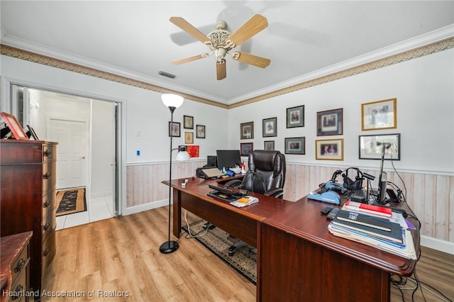 office space featuring ceiling fan, crown molding, and light hardwood / wood-style flooring