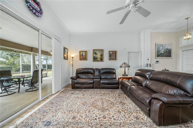 living room featuring ceiling fan and ornamental molding