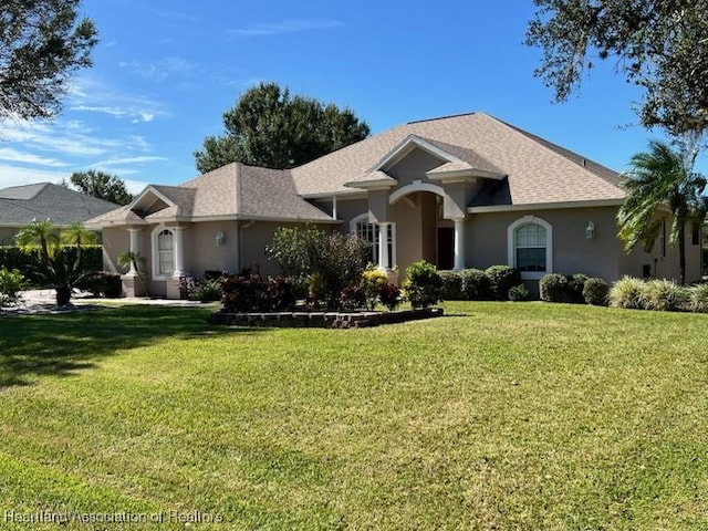 single story home with a front yard