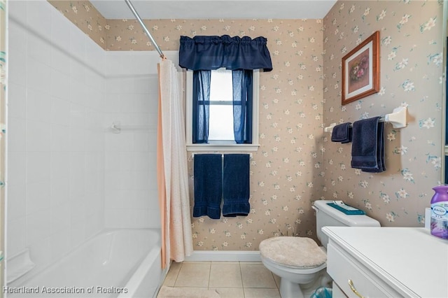 bathroom with tile patterned floors, shower / bath combination with curtain, and toilet