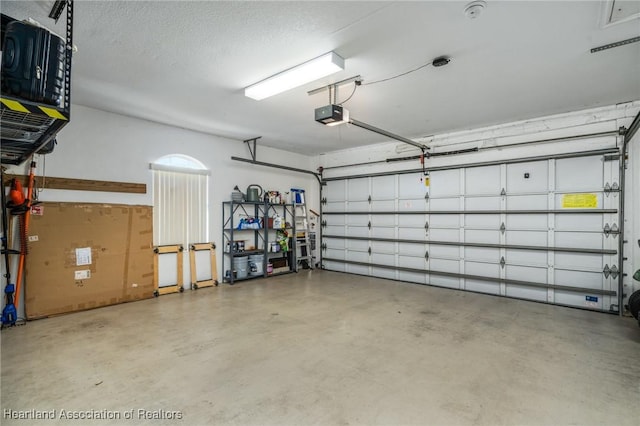 garage featuring a garage door opener