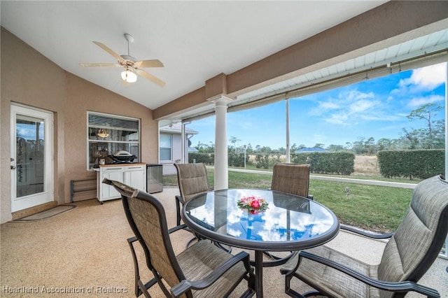 sunroom with vaulted ceiling and ceiling fan