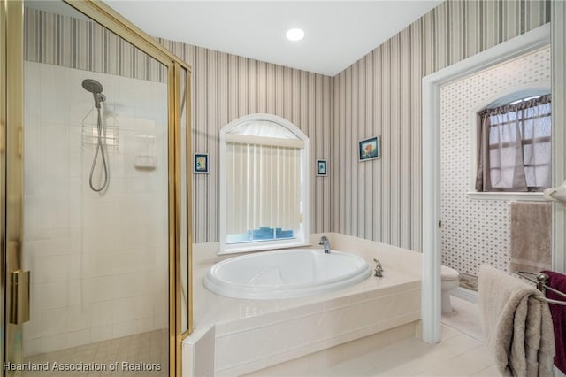 bathroom with tile patterned floors, toilet, and plus walk in shower