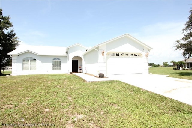 single story home featuring a front lawn and a garage