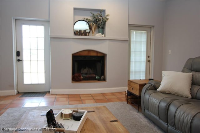 living room with light tile patterned flooring