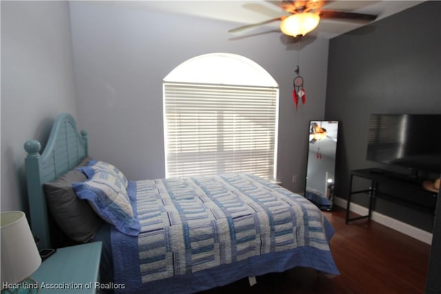 bedroom featuring ceiling fan and dark hardwood / wood-style floors