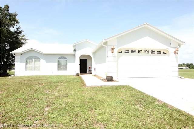 single story home with a garage and a front lawn