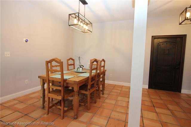 dining space with tile patterned flooring