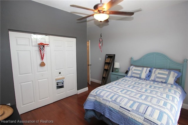 bedroom featuring ceiling fan, a closet, and dark hardwood / wood-style floors