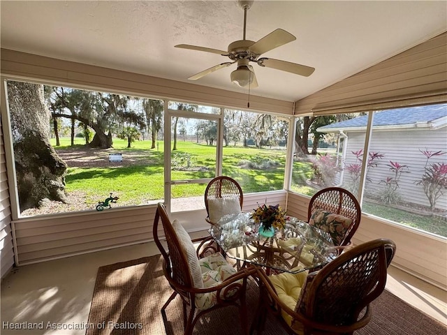 sunroom with vaulted ceiling and ceiling fan